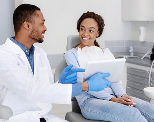 a patient speaking with her cosmetic dentist