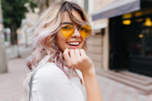 Young woman on the street looking back and smiling